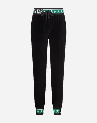 Shop Dolce & Gabbana Velvet Jogging Pants With Dg Logo Bands In Black