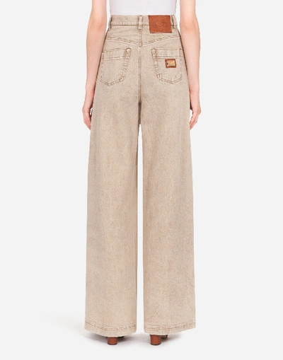 Shop Dolce & Gabbana Flared Denim Jeans In Beige