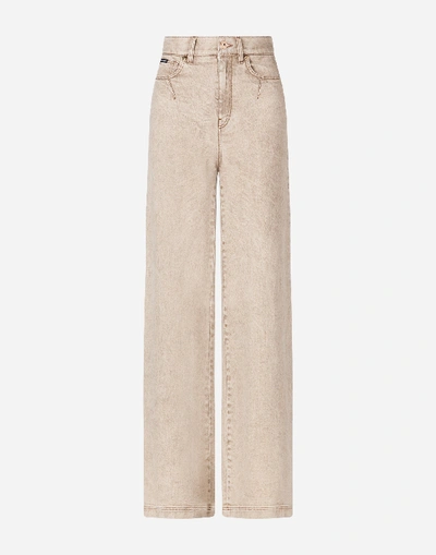 Shop Dolce & Gabbana Flared Denim Jeans In Beige