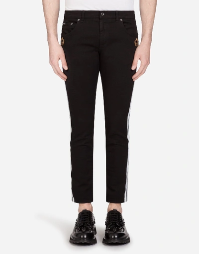 Shop Dolce & Gabbana Stretch Skinny Jeans With Strips And Patch