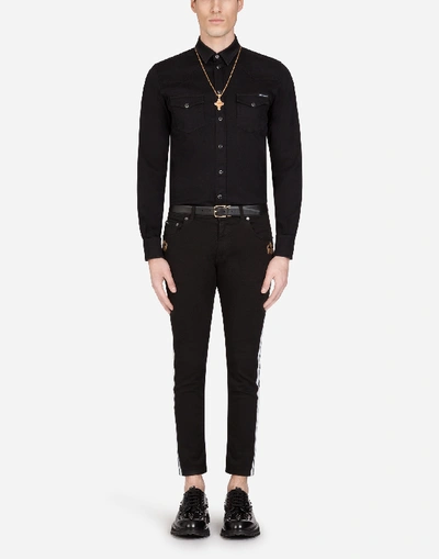 Shop Dolce & Gabbana Stretch Skinny Jeans With Strips And Patch