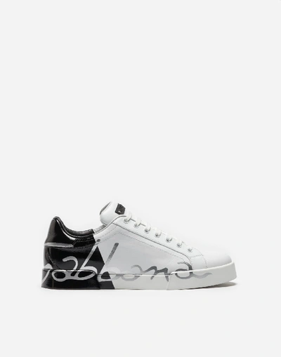 Shop Dolce & Gabbana Patent Calfskin Portofino Sneakers In White/black