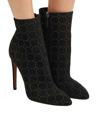 Shop Alaïa Ankle Boots In Black