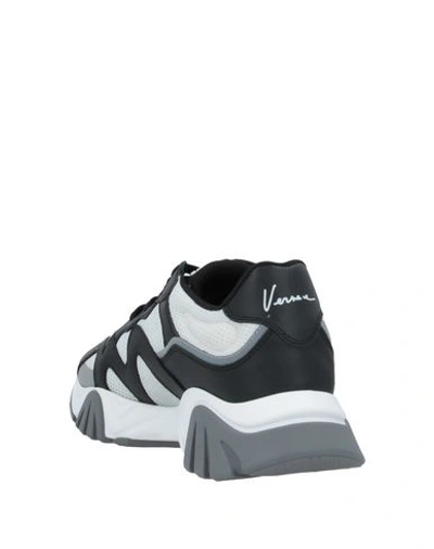 Shop Versace Sneakers In White