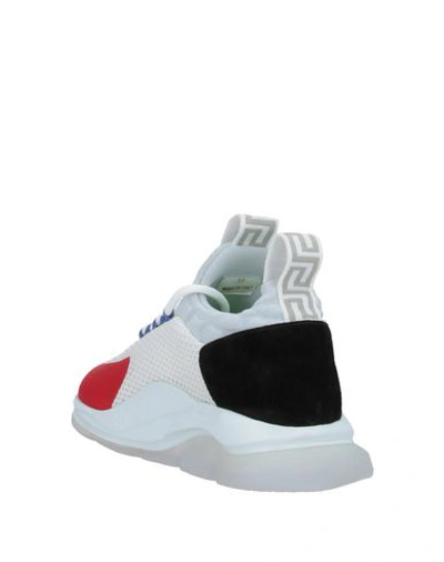 Shop Versace Sneakers In White