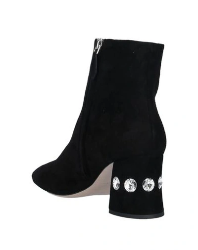 Shop Miu Miu Ankle Boots In Black