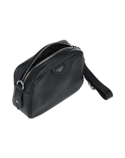 Shop Moschino Cross-body Bags In Black