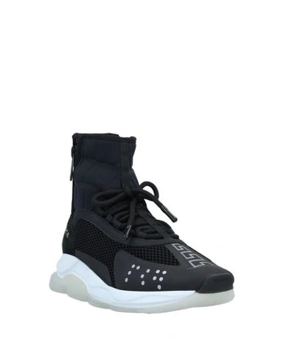 Shop Versace Sneakers In Black