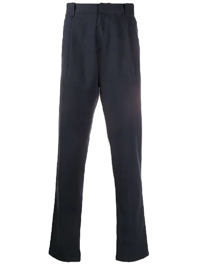 Shop Brioni Tapered Trousers In Blue