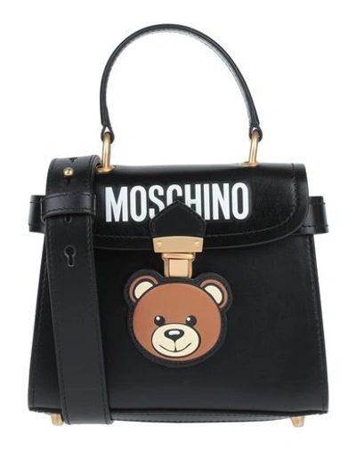 Shop Moschino Cross-body Bags In Black