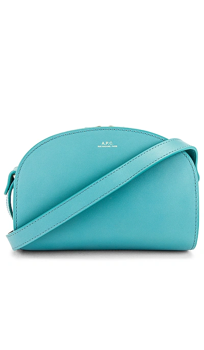 Shop Apc Sac Demi Lune Mini Crossbody Bag In Turquoise