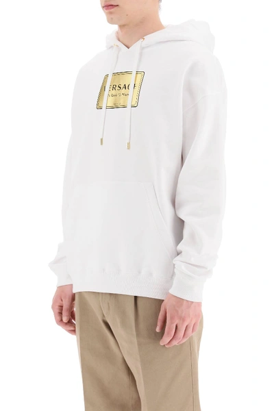 Shop Versace Plaque Print Hoodie In White,gold