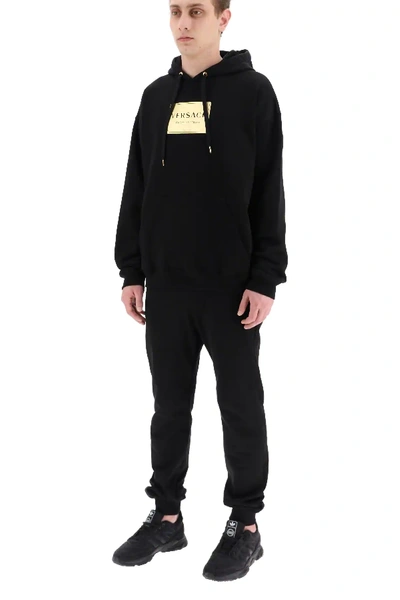 Shop Versace Plaque Print Hoodie In Black,gold