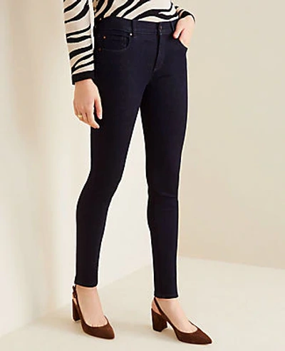Shop Ann Taylor Petite Sculpting Pocket Skinny Jeans In Classic Rinse Wash