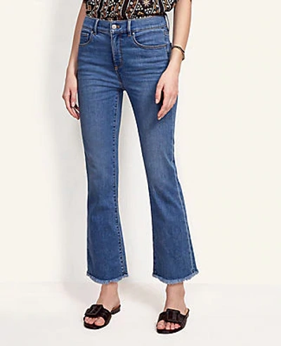 Shop Ann Taylor Sculpting Pocket High Rise Frayed Kick Crop Jeans In Vintage Indigo Wash