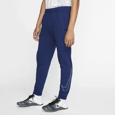 Shop Nike Dri-fit Men's Training Pants (blue Void) In Blue Void,white