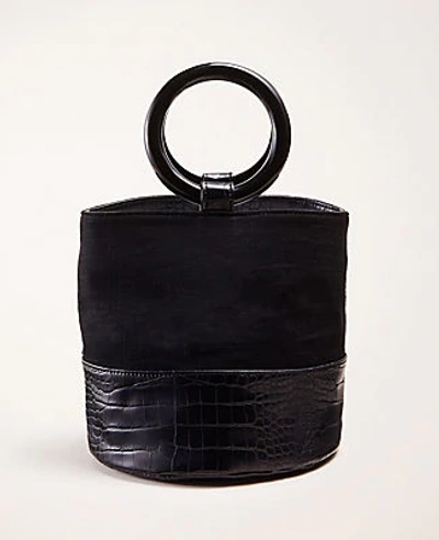 Shop Ann Taylor Crocodile Print Tassel Bucket Bag In Black