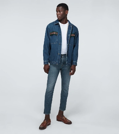 Shop Gucci Washed Denim Tapered Jeans In Blue