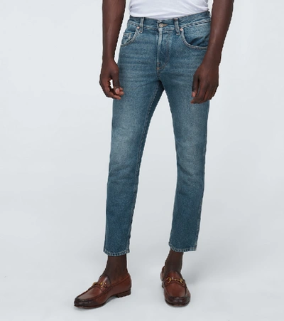 Shop Gucci Washed Denim Tapered Jeans In Blue