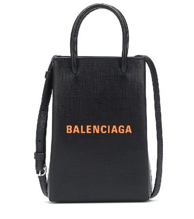 Shop Balenciaga Shopping Phone Pouch Leather Tote In Black