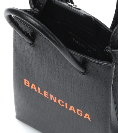 Shop Balenciaga Shopping Phone Pouch Leather Tote In Black