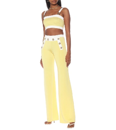 Shop Balmain High-rise Knit Flared Pants In Yellow