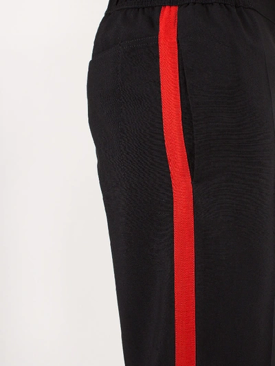 Shop Haider Ackermann Casual Trousers Cosmos Black Red