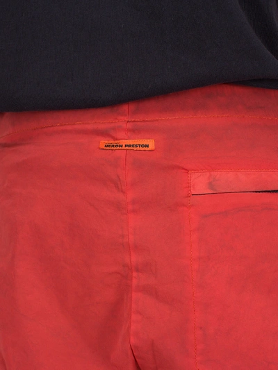 Shop Heron Preston Side Zip Pants Washed Red