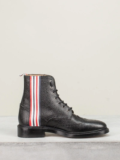 Shop Thom Browne Classic Wingtip Boot 4 Bar Emboss Leather Sole In Pebble Grain In Black