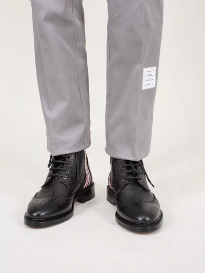 Shop Thom Browne Classic Wingtip Boot 4 Bar Emboss Leather Sole In Pebble Grain In Black