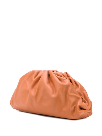Shop Bottega Veneta The Pouch Leather Handbag In Orange