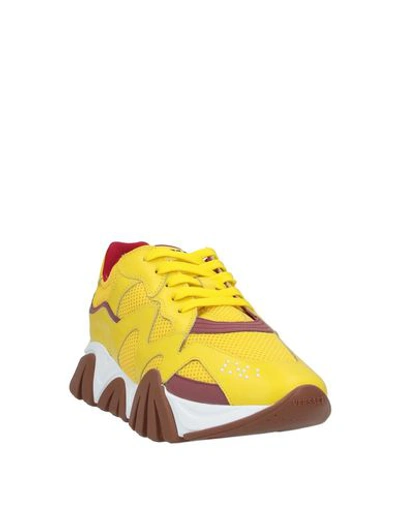 Shop Versace Sneakers In Yellow