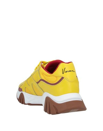 Shop Versace Sneakers In Yellow