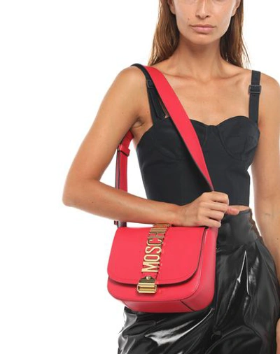 Shop Moschino Cross-body Bags In Red