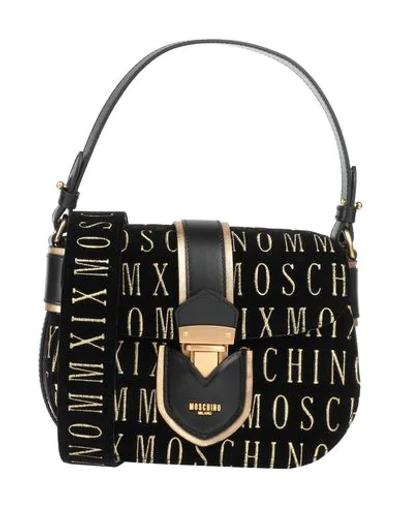 Shop Moschino Cross-body Bags In Black