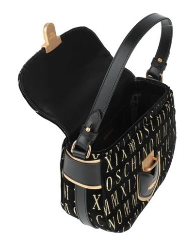 Shop Moschino Cross-body Bags In Black