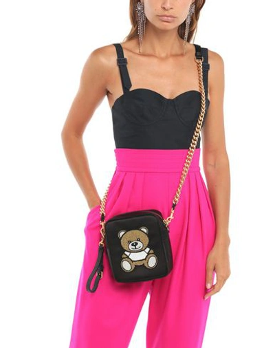 Shop Moschino Handbags In Black