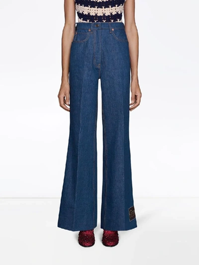 Shop Gucci Logo Label Flared Jeans In Blue