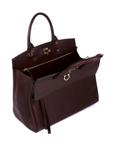 Shop Ferragamo Handbag In Maroon