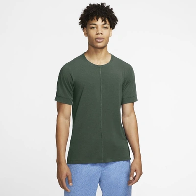 Shop Nike Yoga Dri-fit Men's Short-sleeve Top In Galactic Jade,black