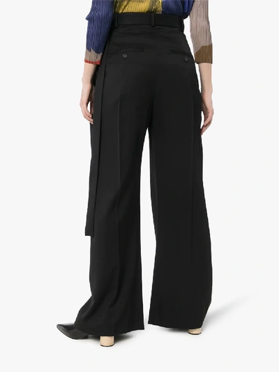 Shop Jw Anderson Buckled Wide Leg Trousers In Black