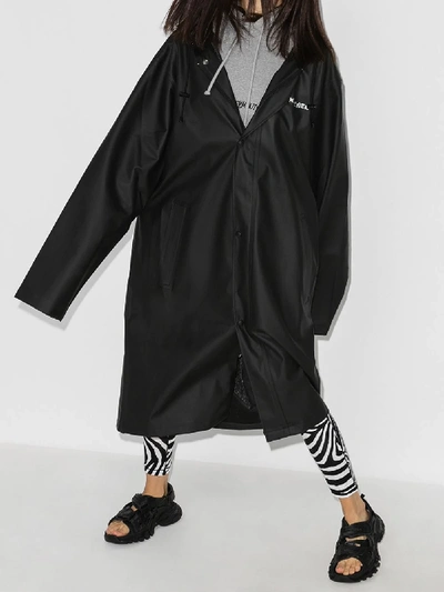 Shop Vetements Oversized Logo Print Raincoat In Black