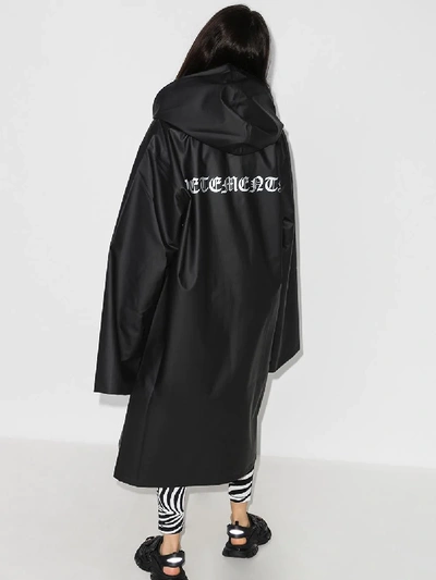 Shop Vetements Oversized Logo Print Raincoat In Black