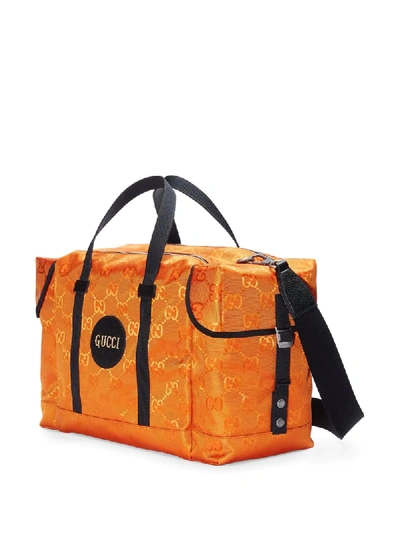Shop Gucci Off The Grid Gg Duffle Bag In Orange