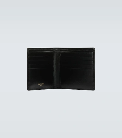 Shop Saint Laurent Tiny Cassandre East/west Leather Wallet In Black