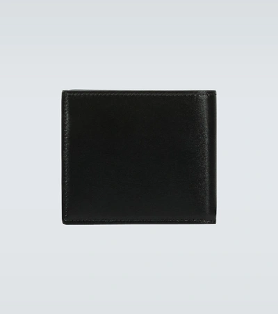 Shop Saint Laurent Tiny Cassandre East/west Leather Wallet In Black