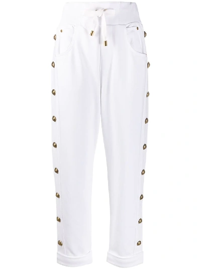 Shop Balmain Embossed-buttons Drawstring Trousers In White