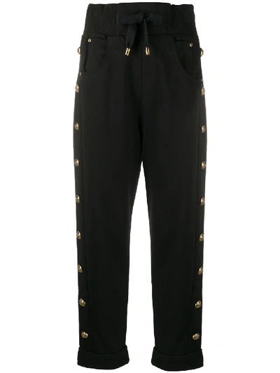 Shop Balmain Embossed-buttons Drawstring Trousers In Black