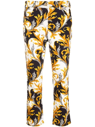 Shop Versace Acanthus Print Cropped Jeans In White