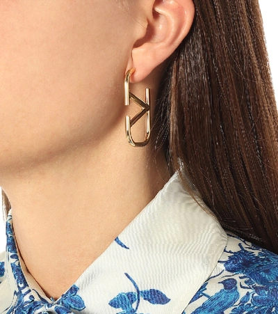 Shop Valentino Vlogo Earrings In Gold